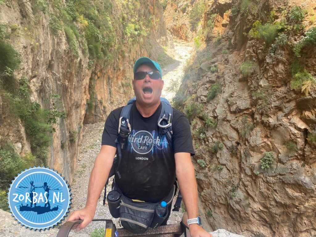 Aradena Gorge on Crete. Aradena Gorge is a dramatic, steep canyon in the Sfakia region of southwest Crete, running from the abandoned village of Aradena down to Marmara Beach. Famous for its towering cliffs, challenging boulder scrambles, and a 138-meter-high metal bridge